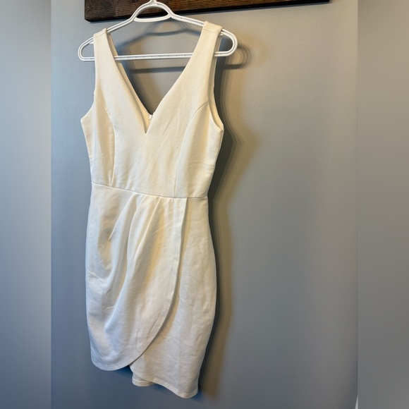 White Asymmetrical Mini Dress with a deep v neckline in size Medium - Picture 3 of 8
